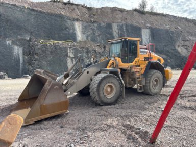 Hjullastare Volvo L180H Med våg, skopa 